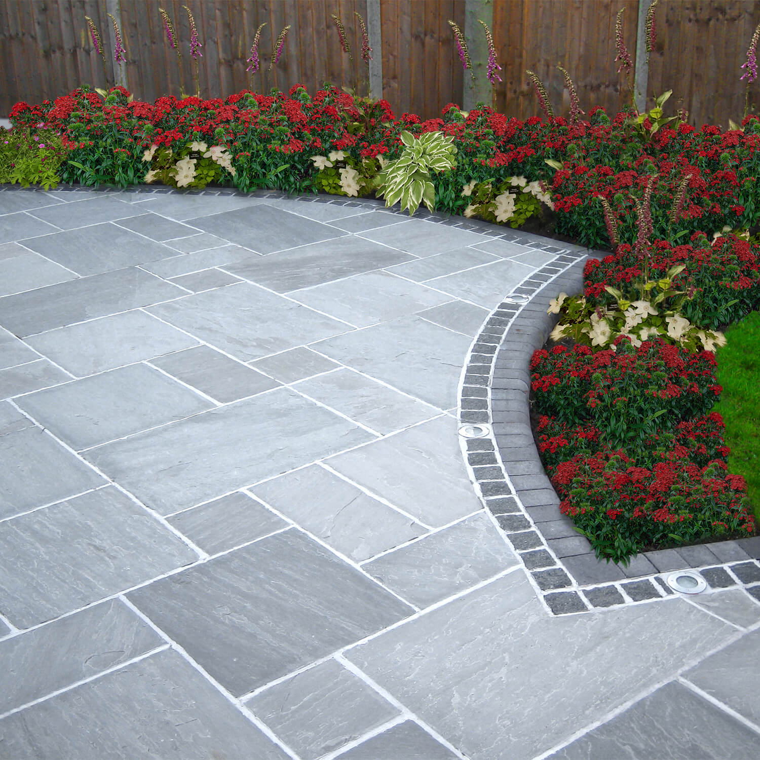 Natural stone driveway by Spot On Driveways