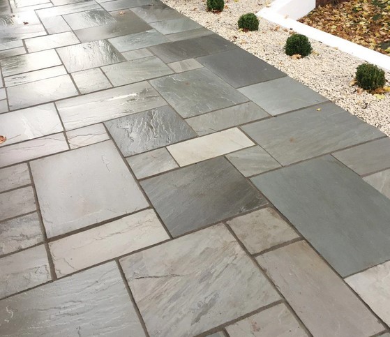 Natural stone patio completed by Spot On Driveways